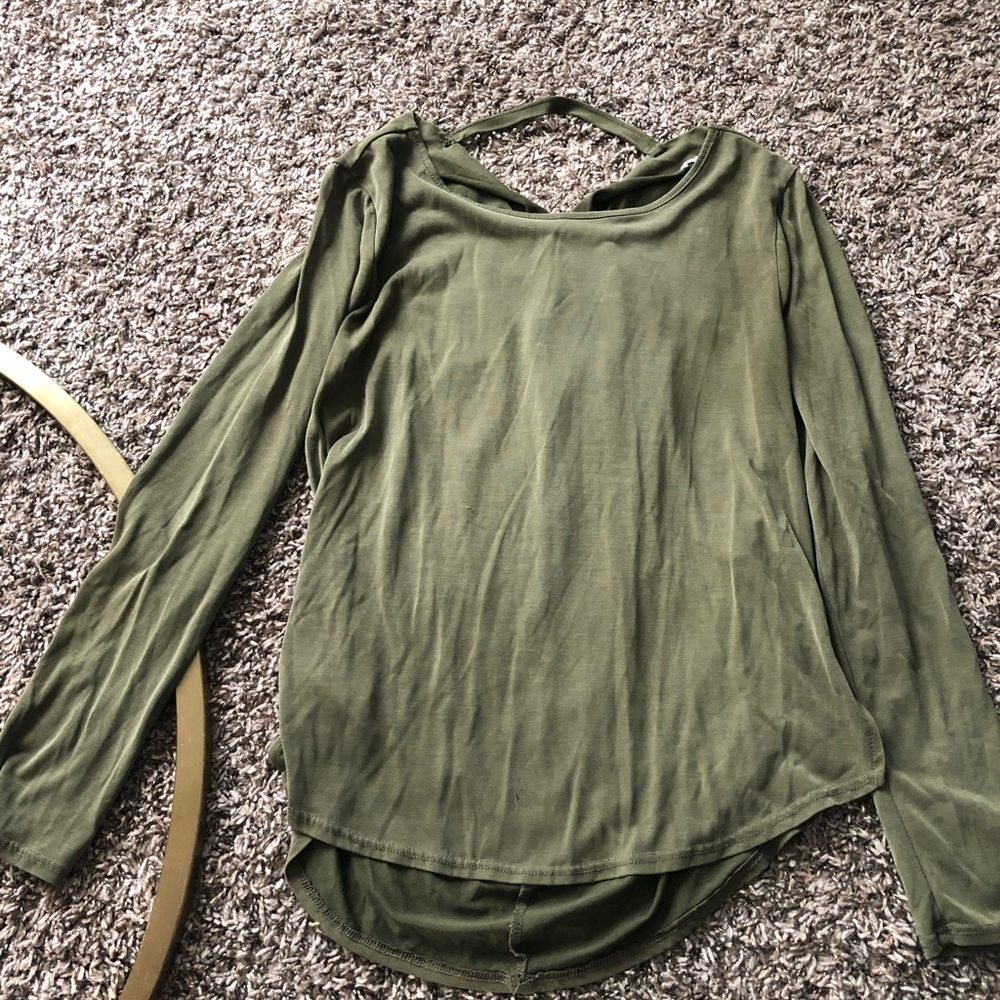 Francesca’s green long sleeve top